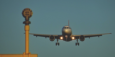 negative-space-airplane-landing-airport-sebastian-grochowicz-400